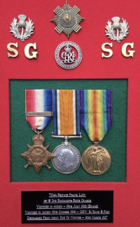 A Superb & Complete “Old Contemptible’s” 1914 Star & Bar Trio 
(Seriously Wounded, Somme) Silver War Badge, No.36835, Cap Badge & Four Collar Dogs. Photo & Full Papers To: 7044. Pte Frank  LUTY. 1st / 2nd Bn Scots Guards. 