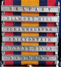 AN EXCEPTIONAL Q.S.A. / K.S.A. PAIR With Six Clasps. To: 9773. Pte H.W. MOORE. COLDSTREAM GUARDS. With service papers (1894) & two "Original Velum" Discharge papers.(1906) A Yorkshire Coal Miner from Normanton.