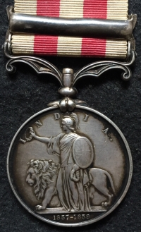 An Excellent INDIAN MUTINY MEDAL, "CENTRAL INDIA"
To: Thomas Stanmore 95th DERBYSHIRE Regt.
On Original Cloth Ribbon with Original Silver Claw Brooch. 
