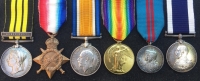 A Unique & Exceptionally Complete, East & West Africa (BENIN 1897) & 1914-15 Trio, 1911 Coronation Medal & LSGC (GV) Plaque & Scroll, Royal Navy Group of Six. With a uniformed photo of the recipient wearing his Africa medal.
