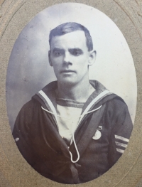 A Unique & Exceptionally Complete, East & West Africa (BENIN 1897) & 1914-15 Trio, 1911 Coronation Medal & LSGC (GV) Plaque & Scroll, Royal Navy Group of Six. With a uniformed photo of the recipient wearing his Africa medal.
