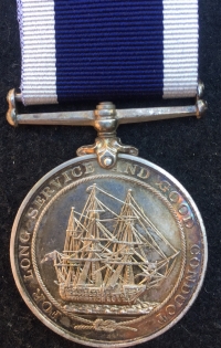 A Unique & Exceptionally Complete, East & West Africa (BENIN 1897) & 1914-15 Trio, 1911 Coronation Medal & LSGC (GV) Plaque & Scroll, Royal Navy Group of Six. With a uniformed photo of the recipient wearing his Africa medal.
