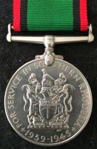 A VERY RARE "FULLY ATTRIBUTED" SOUTHERN RHODESIA WAR MEDAL. 1939-1945. WITH ISSUE SLIP & ORIGINAL ADDRESSED REGISTERED ENVELOPE 
