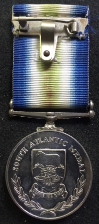 An Outstanding ROYAL NAVY South Atlantic (Falklands War)
Medal with Rosette.To: AB. J.W. PARKINSON. D182476K 
Crew of  ”Leander Class Destroyer” H.M.S. ARGONAUT. Badly Damaged when Hit by Two Unexploded Argentinian Bombs.