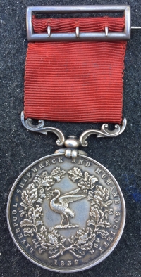 AN EXCEPTIONALLY WELL DOCUMENTED & EARLY  “LIVERPOOL SHIPWRECK & HUMANE SOCIETY’S FIRE MEDAL”. To: P.C. 158B. Fred W. Baxter, Rescued 3 Children From House On Fire in Lowndes St, L’Pool. 24th May 1896.