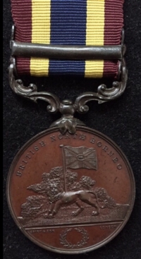 A Totally Exceptional & Very Rare BRITISH NORTH BORNEO COMPANY MEDAL. Clasp. “PUNITIVE EXPEDITIONS”  MINT STATE & “PROOFLIKE BRONZE”