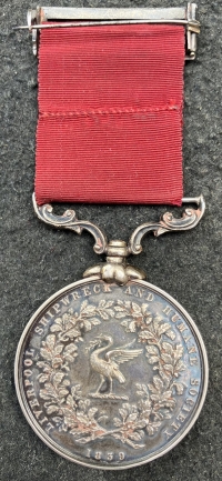 A VERY DESIRABLE & EARLY (1912) “LIVERPOOL SHIPWRECK & HUMANE SOCIETY’S FIRE MEDAL“ With colour photo of recipient in later life.To: JAMES BAXENDALE-MOSS.With CASUALTY son’s WW2  medals.