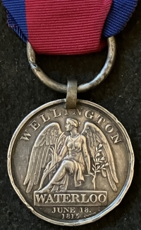 A DESIRABLE & HISTORICALLY IMPORTANT “WATERLOO MEDAL”
To: Pte WILLIAM HODGIN, 2nd Bn GRENADIER GUARDS, 
A SERIOUSLY WOUNDED DEFENDER at HOUGOUMONT FARM, WHO LOST A LEG.