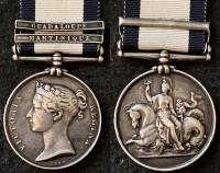 A Rare Officer’s NAVAL GENERAL SERVICE MEDAL (Two Clasps)
GUADALOUPE & MARTINIQUE  To: Lieut JOHN MACNEVIN R.N. Fought at New Orleans, U.S.A. during American War of 1812.
Full service record & biography.